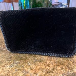 Stella McCartney clutch/crossbody bag with gunmetal hardware.